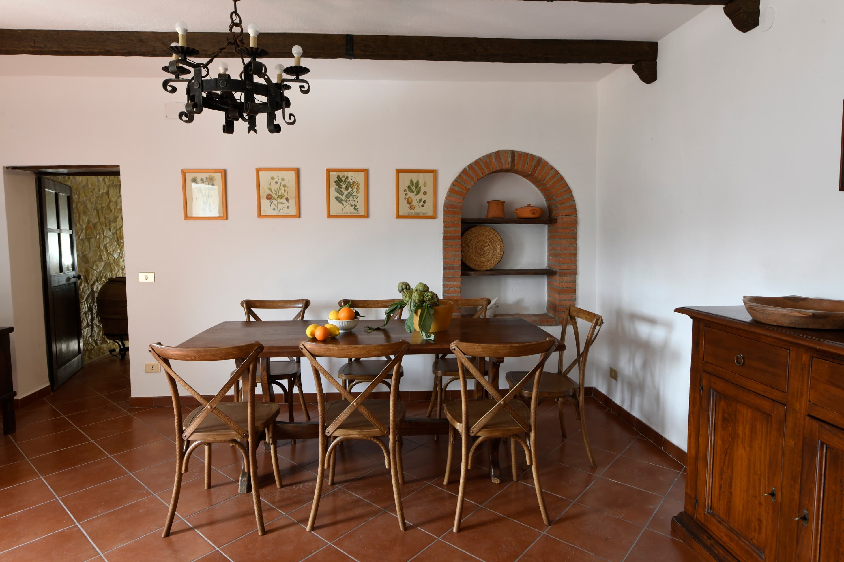 view on dining table with 8 chairs in spacious kitchen