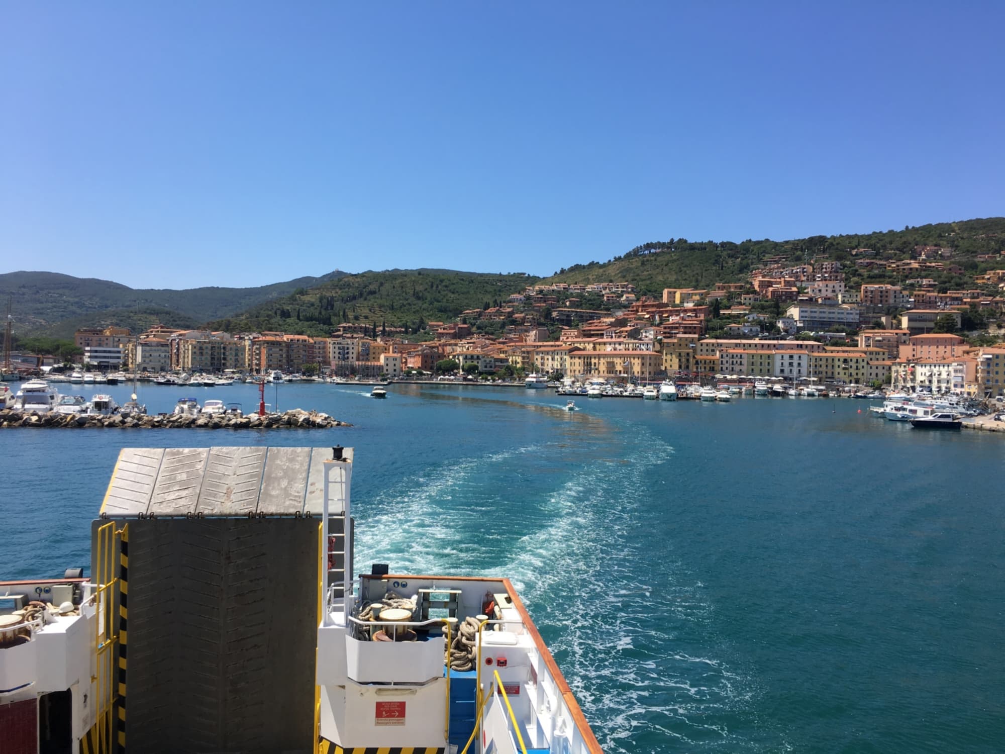 The town of Porto Santo Stefano, as seen from the ferry traveling in the direction of Giglio Island