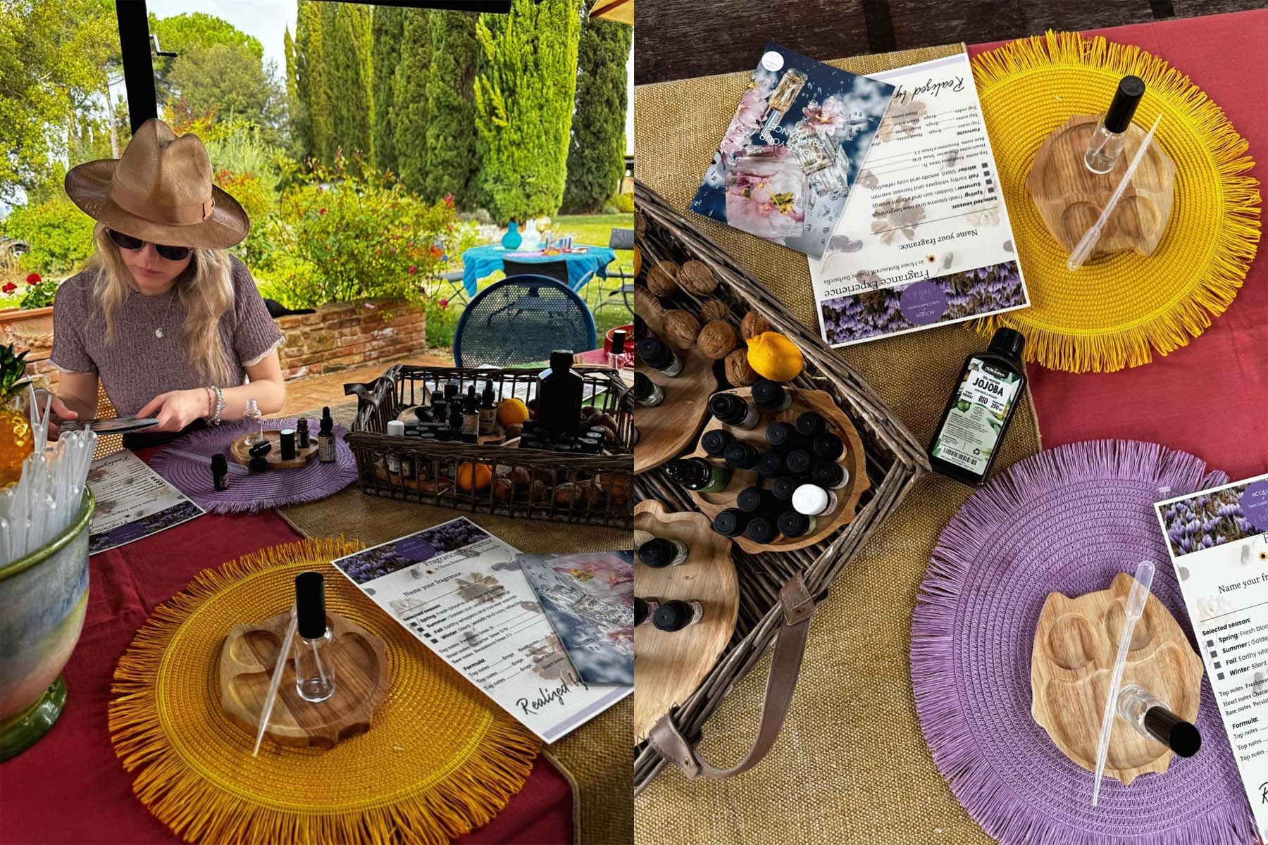 Donna con cappello e occhiali da sole compone la propria fragranza al tavolo da lavoro, accanto a un vassoio con boccette di essenze, noci, limone e olio di jojoba biologico