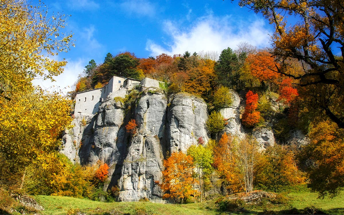 A view of the Sanctuary of La Verna from below, bathed in the colors of fall