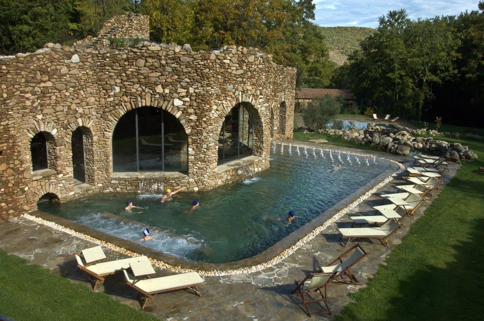 Outdoor swimming pool of the Sassetta Thermal Spa in the valley of Pian delle Vigne in Sassetta.